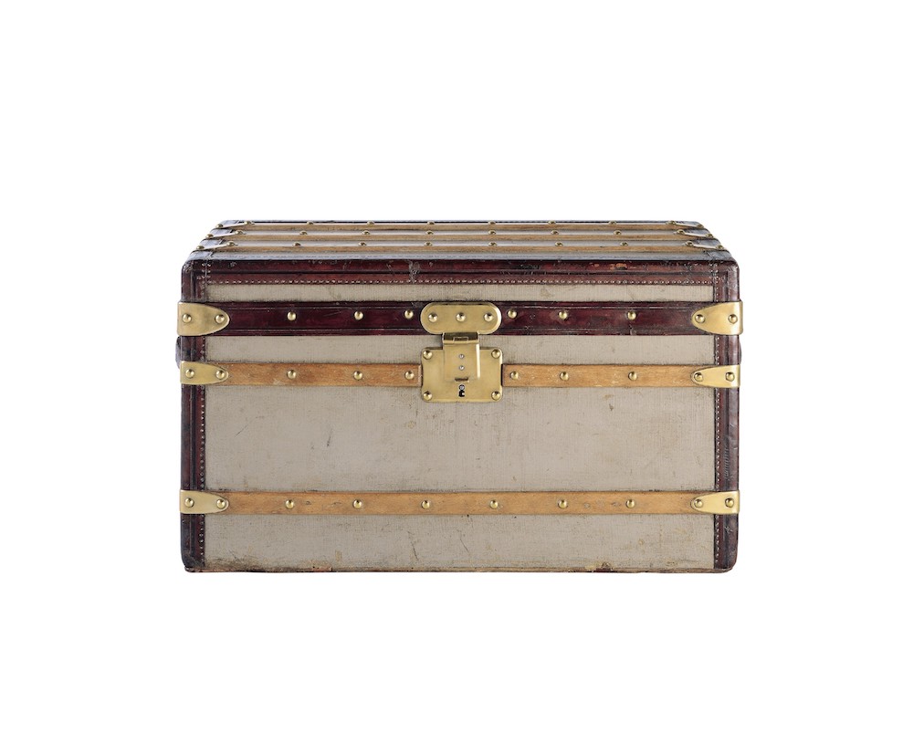 Flat trunk in Trianon gray canvas, 1879. Courtesy to Louis Vuitton.