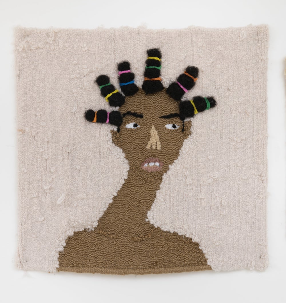 Anya Paintsil, Jazzy and Snazzy, 2022, Acrylic, Wool, Alpaca, Synthetic Hair, Human Hair and Hair Ties on Hessian, 25 x 26 in. Courtesy of Hannah Traore Gallery
