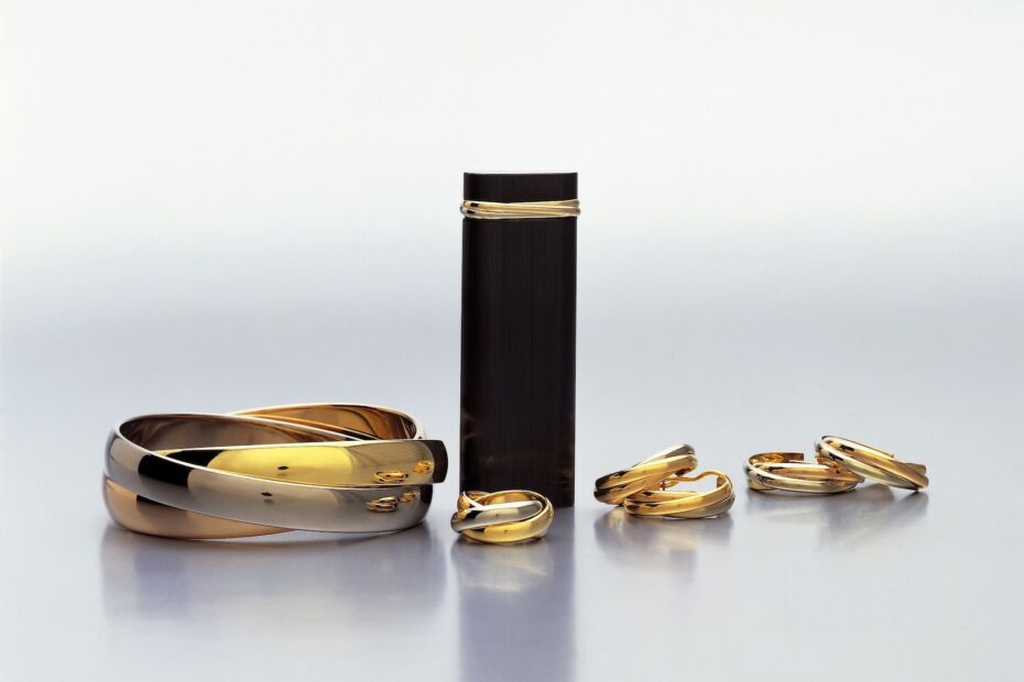 Trinity collection: bracelet, earrings and three-band rings, three-band lighter, 1982,